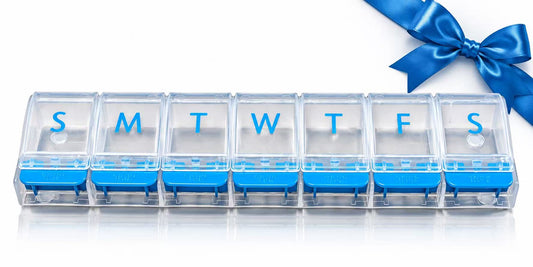 7-Day pill planner with seven clear compartments and blue push-button tabs